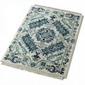 Vintage floral patterned area rug in blue and ivory 150 x 100 x 1cm